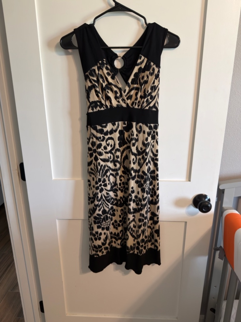 Sleeveless Black and Cream Animal-Print Midi Dress with Ring Detail